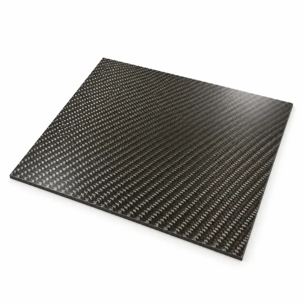 Glossy carbon fibre sheet showing the woven surface and thin, flat edge on a white background